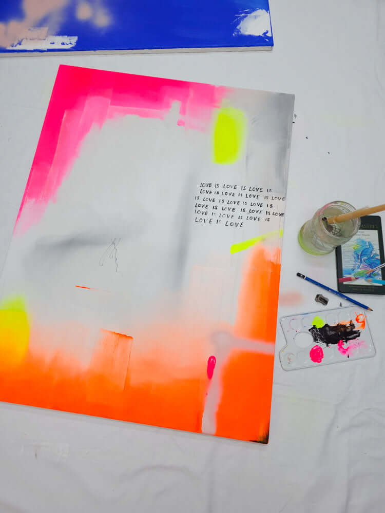 Mixed media artwork titled 'Love is Love' featuring vibrant colors and dynamic brush strokes on canvas.